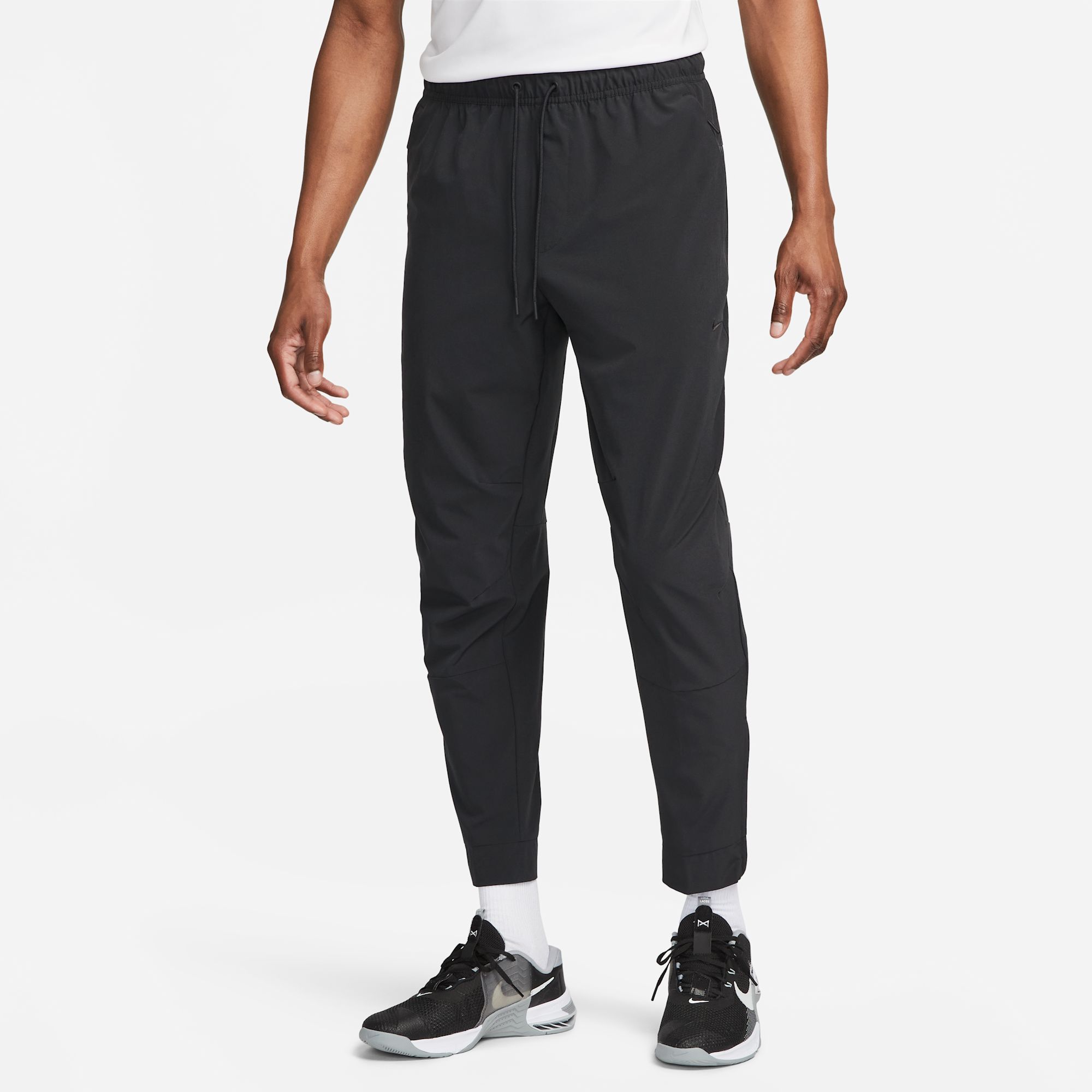 Nike Unlimited Pantalones versátiles Dri-FIT con puños con cierre para hombre